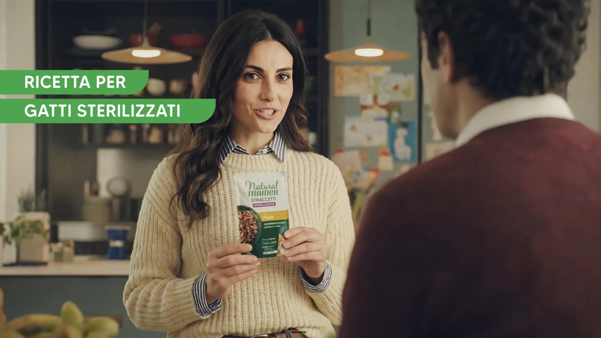 Affinity Natural Trainer, AI-generated frame: a woman holding the pack for sterilised cats
