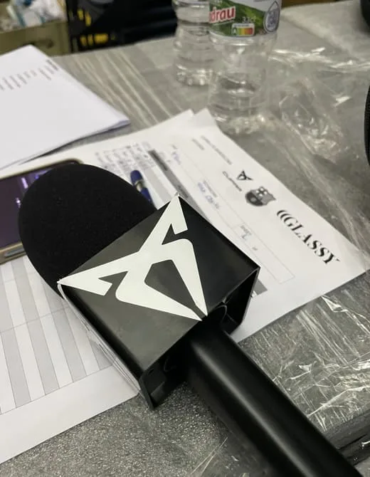 FCB x CUPRA event: Cupra-branded microphone on the run sheet before the live broadcast