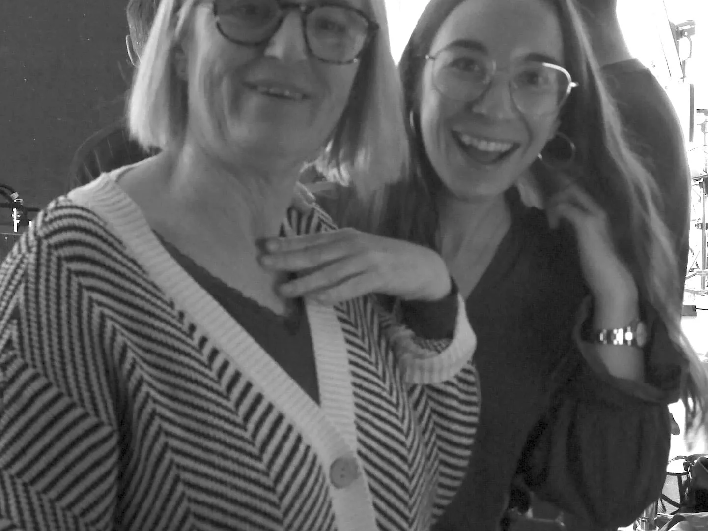 Isdin Hyaluronic making of: two team members smiling for the camera on set, black and white