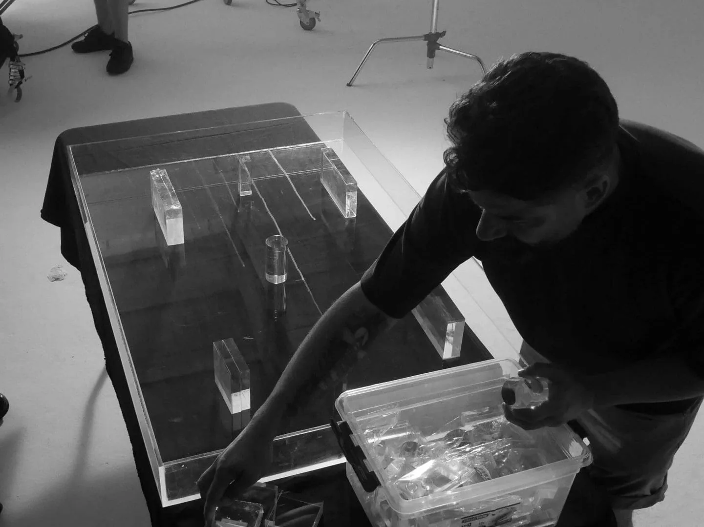 Isdin Ureadin shoot: art department placing acrylic blocks on a glass table for product shots