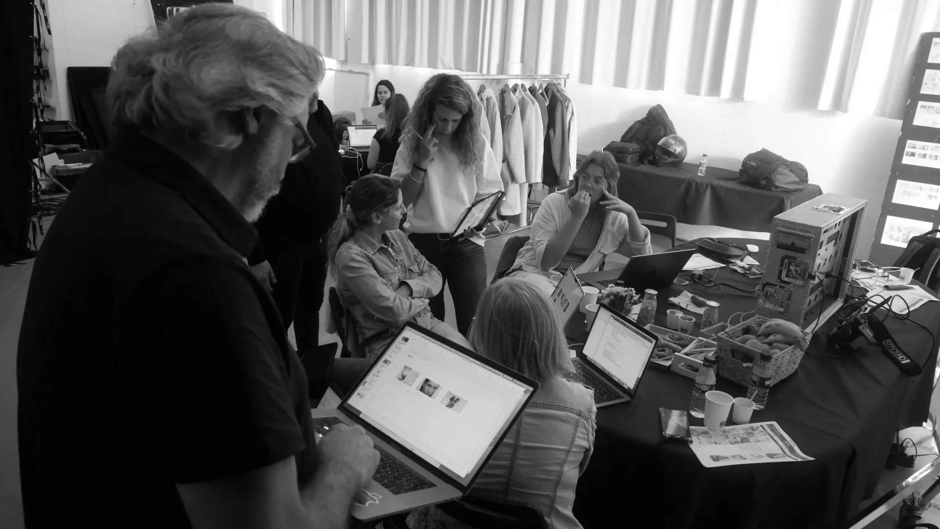 Isdin Ureadin shoot: production team working on laptops in the wardrobe and production room