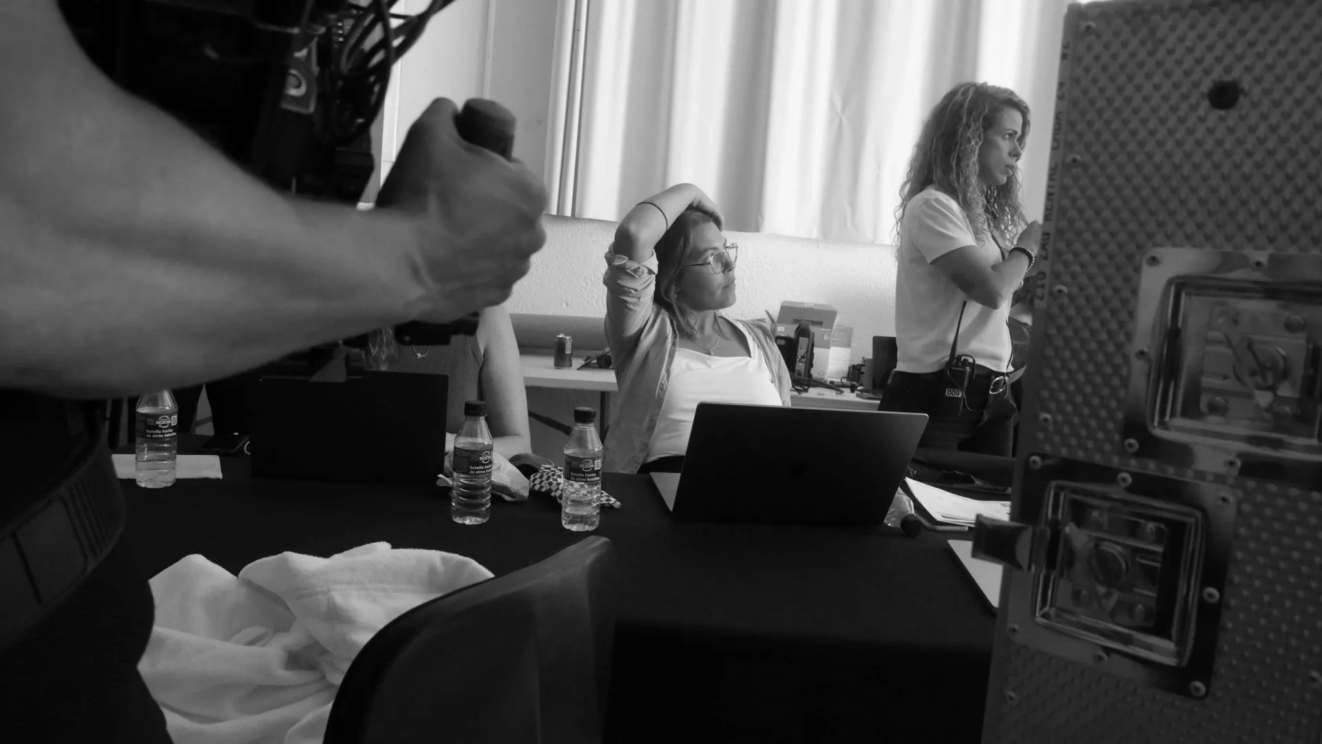 Isdin Ureadin shoot: production team at their laptops in the base room between takes