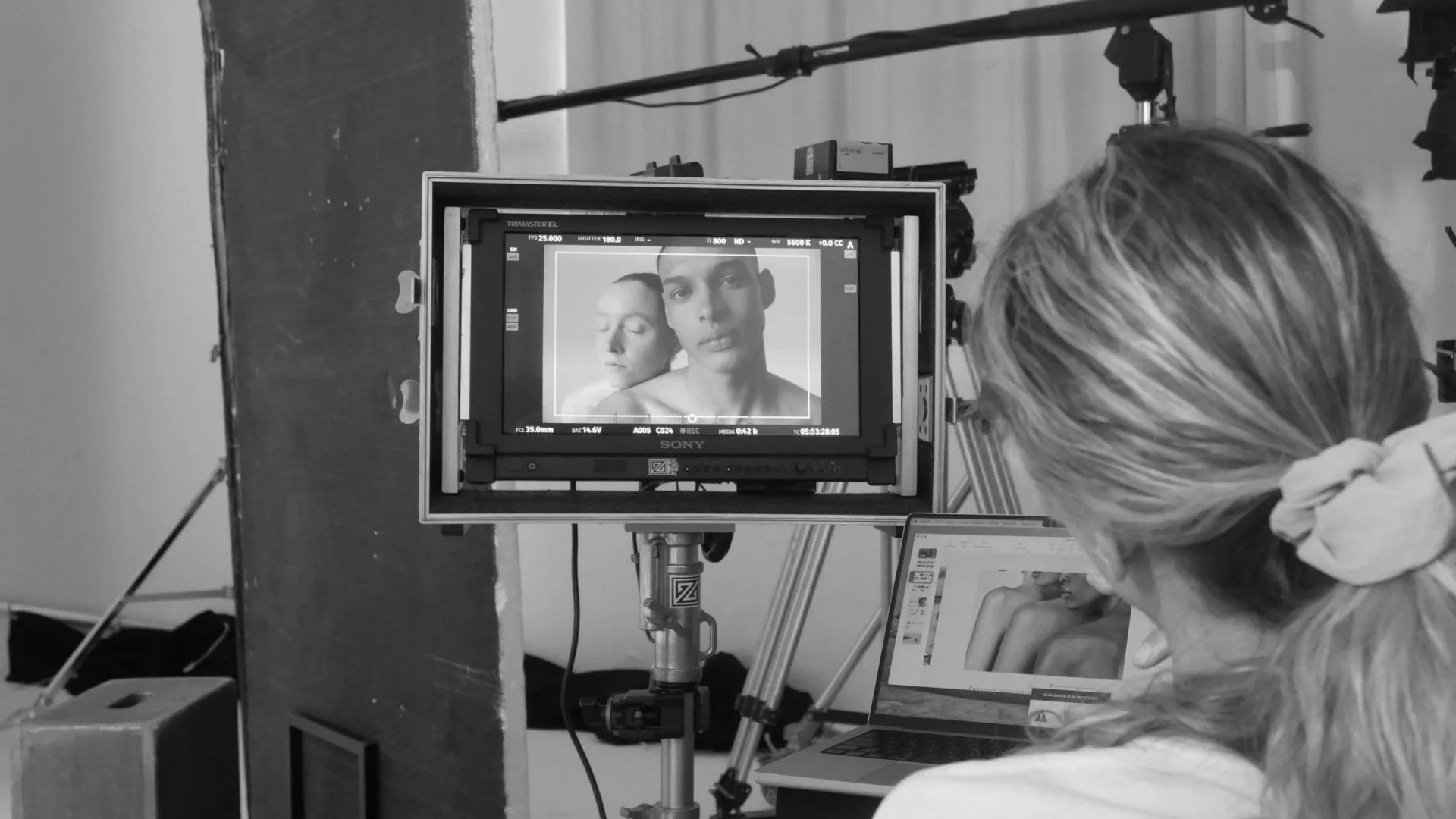 Isdin Ureadin shoot: crew member watching a close-up of two models on the monitor