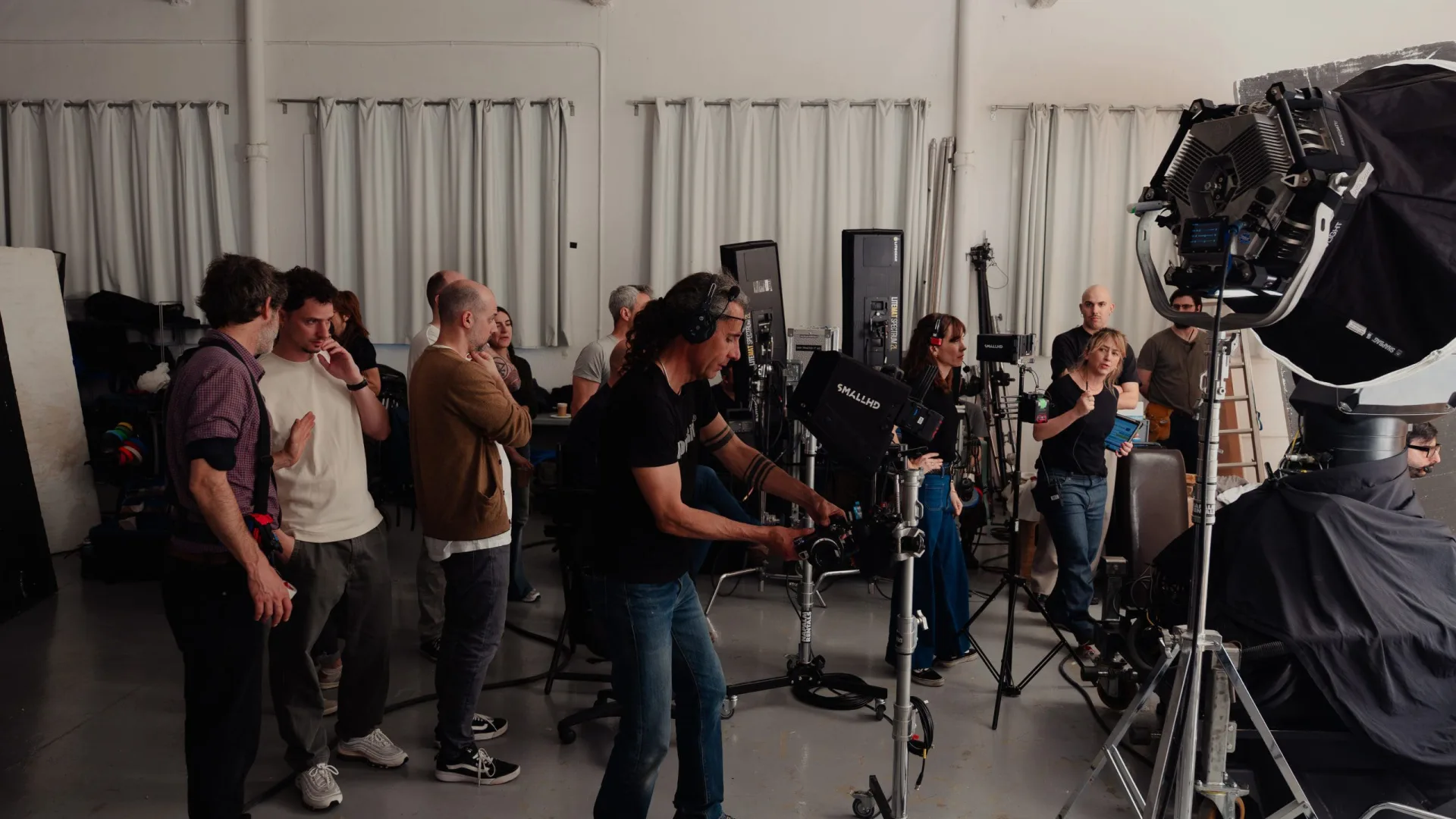 Sanex UAP shoot: crew gathered around the camera and lights in a white studio