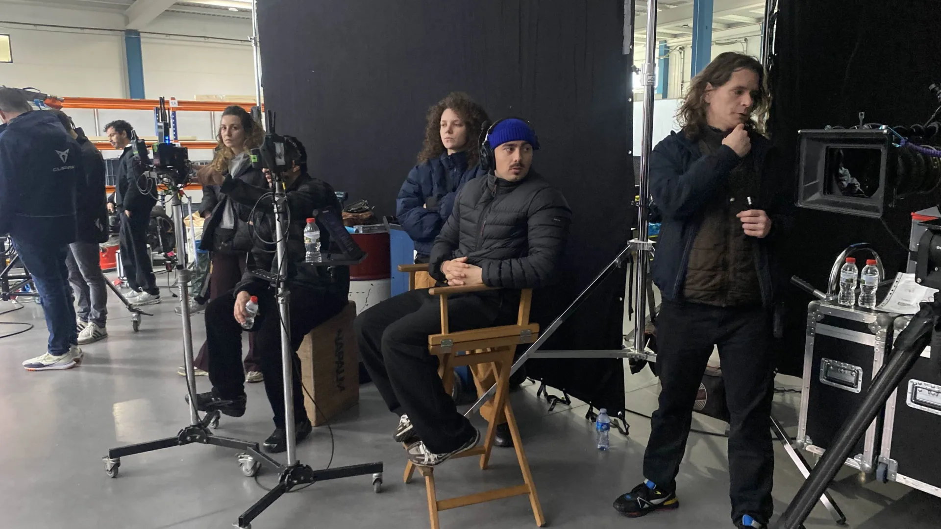Seat Connect shoot: crew and video village watching the take from director's chairs