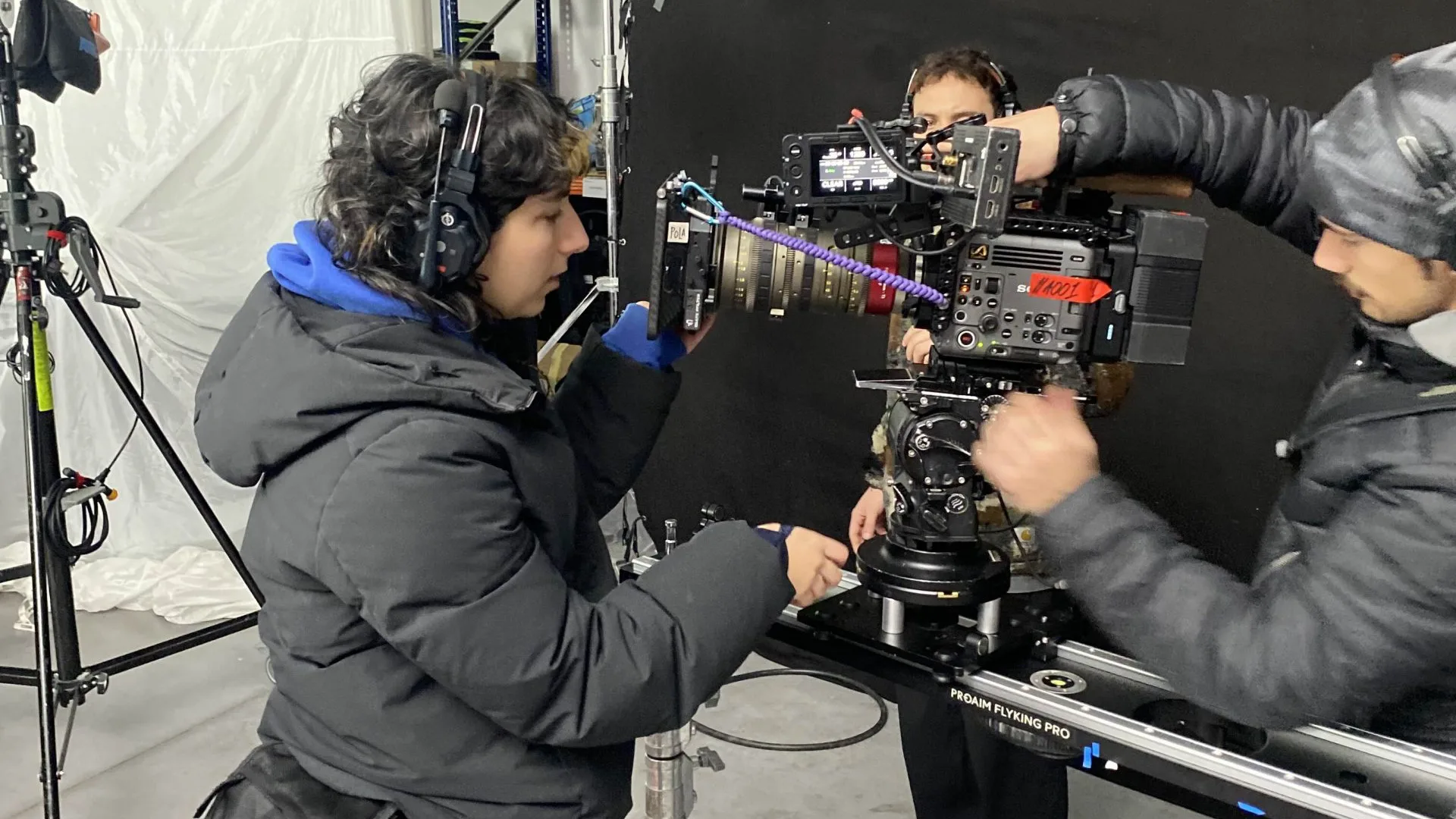 Seat Connect shoot: camera assistants setting up a cinema camera on a slider in the studio