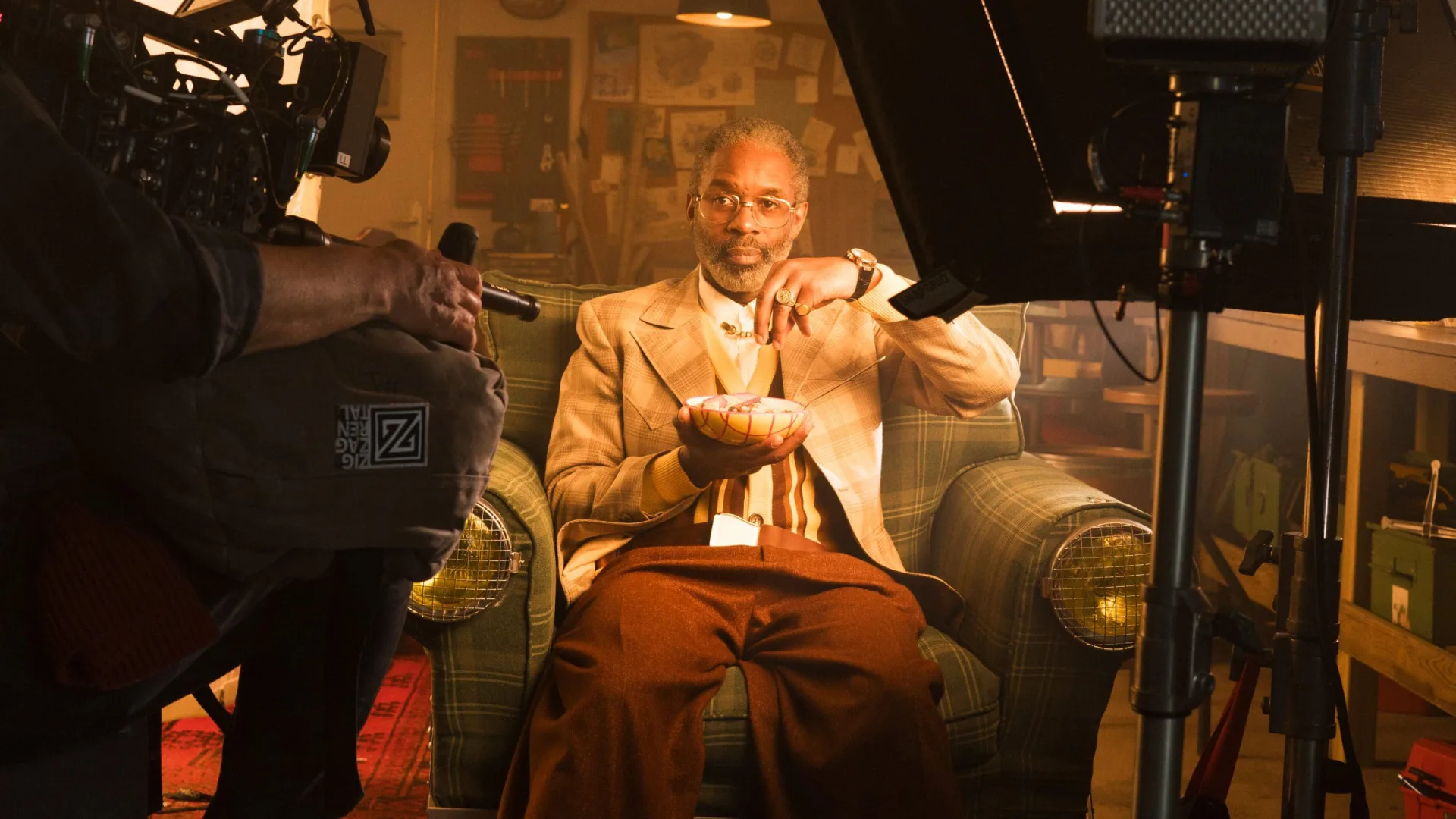 Shredded Wheat shoot: camera filming the actor holding a bowl of cereal in the armchair