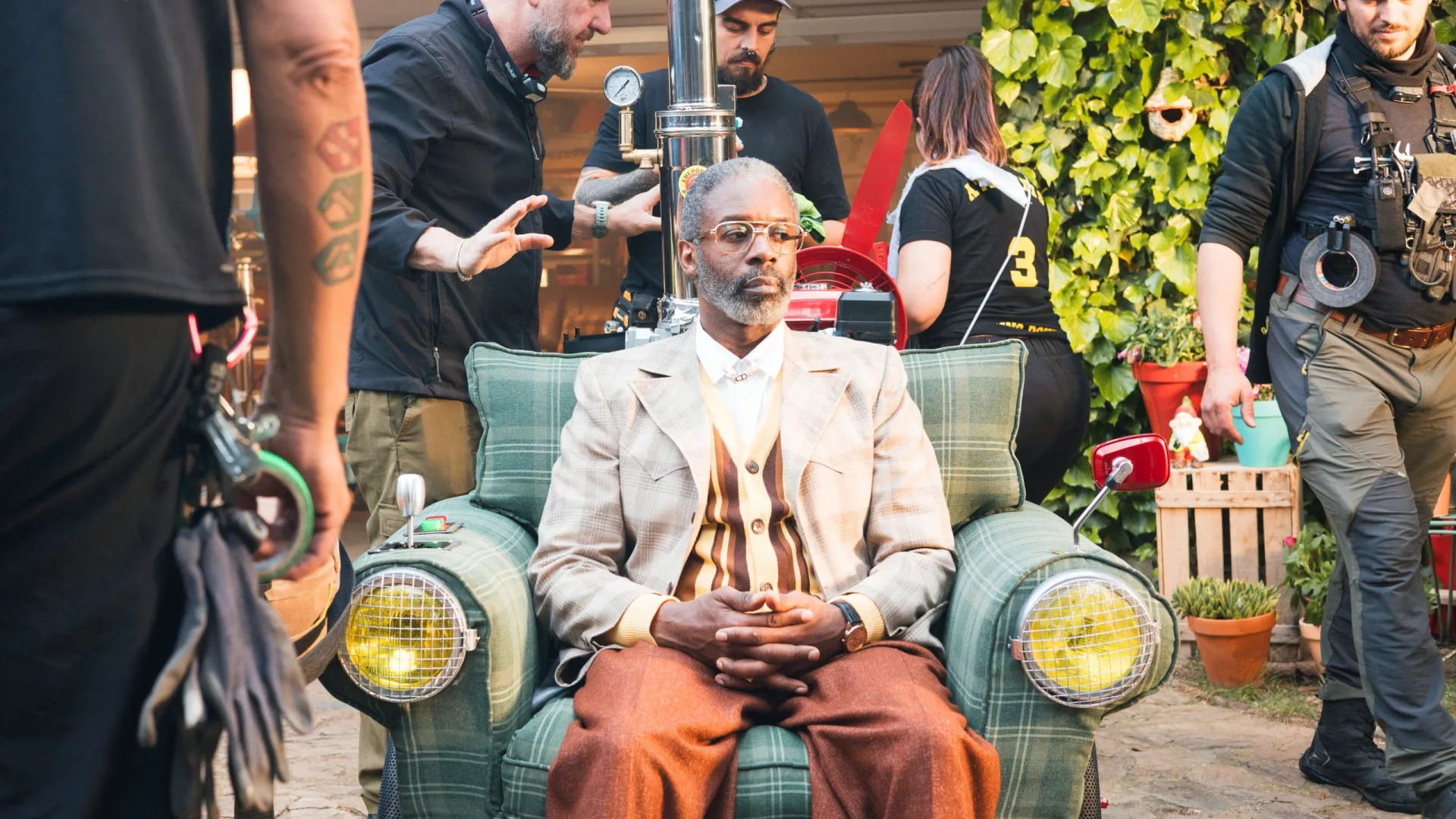 Shredded Wheat shoot: the actor waits in the armchair vehicle while the crew prepares the shot
