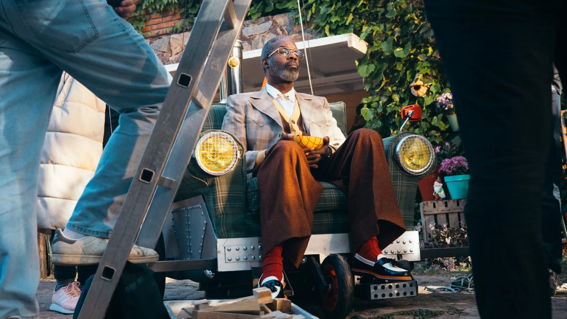 Shredded Wheat shoot: the actor seated in the armchair vehicle as the crew sets up