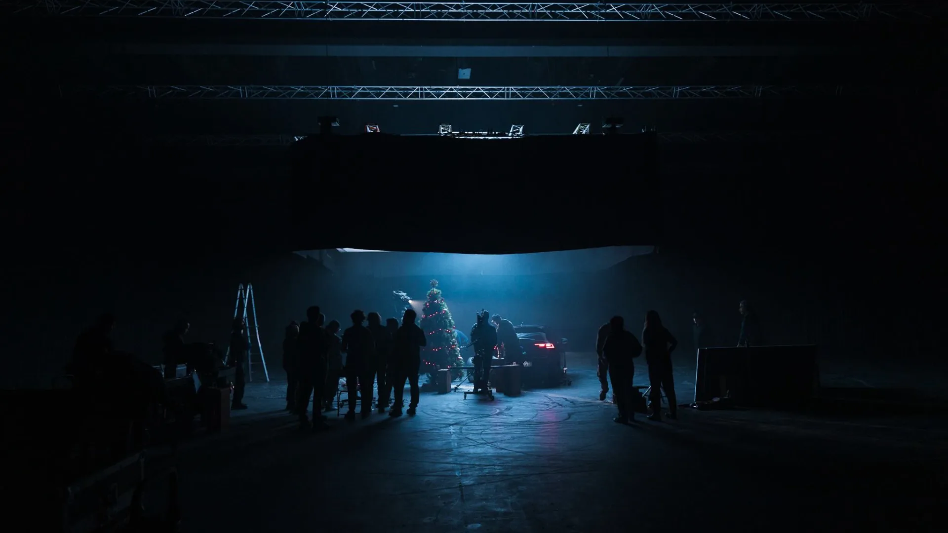 Volkswagen Golf GTI shoot: crew silhouettes around the car and a Christmas tree in the studio