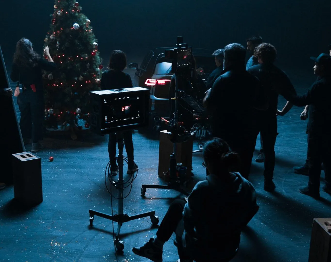 Volkswagen Golf GTI shoot: crew around the monitor and camera, Christmas tree and car behind