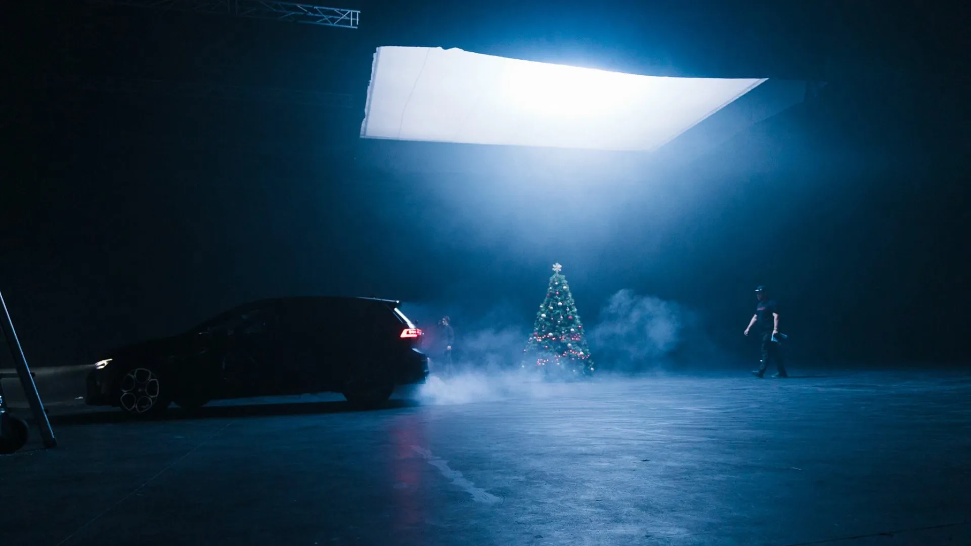 Volkswagen Golf GTI shoot: the car drifts through smoke past a Christmas tree