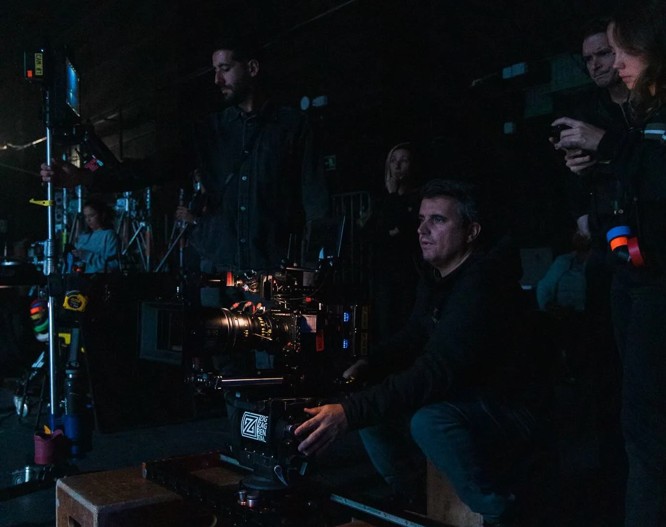 Volkswagen Golf GTI shoot: camera operator on a low slider among apple boxes, crew behind